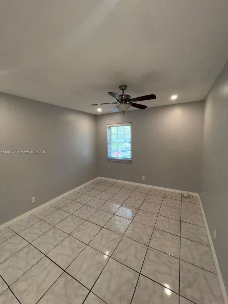 1799 Southwest 81st Terrace, Unit 135 Davie, FL 33324 - Photo 13 of 19 a view of an empty room and window