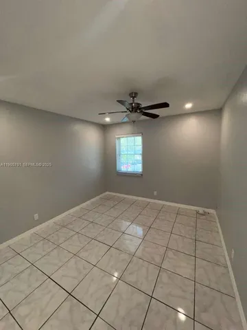 a view of an empty room and window