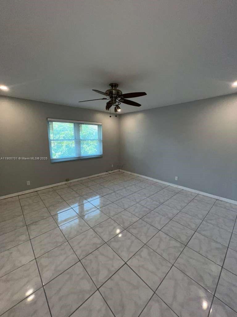 1799 Southwest 81st Terrace, Unit 135 Davie, FL 33324 - Photo 14 of 19 a view of an empty room and window