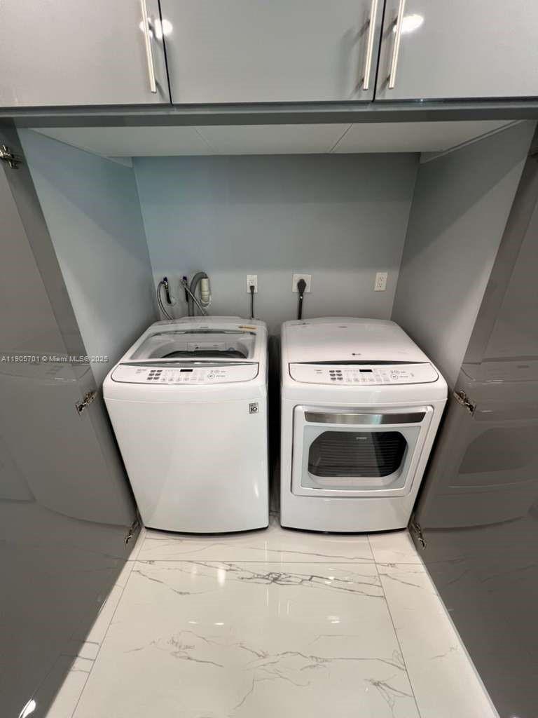 1799 Southwest 81st Terrace, Unit 135 Davie, FL 33324 - Photo 6 of 19 a utility room with dryer and washer