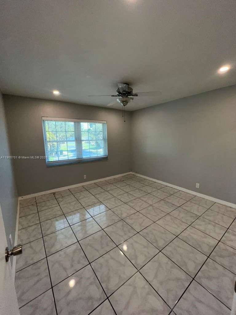 1799 Southwest 81st Terrace, Unit 135 Davie, FL 33324 - Photo 9 of 19 a view of an empty room and window
