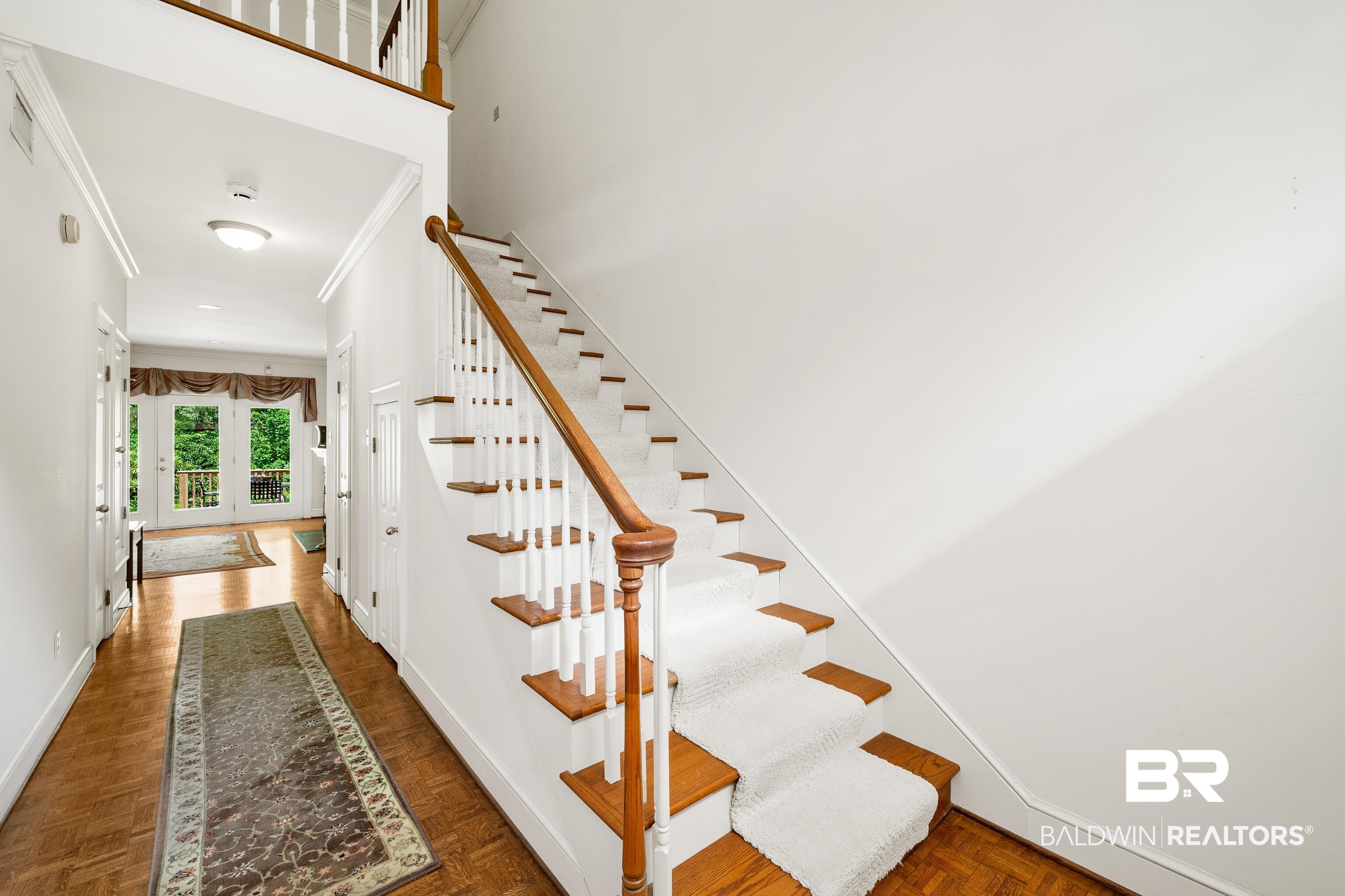 4272 Bit And Spur Road, Unit 12 Mobile, AL 36608 - Photo 5 of 34 Staircase with ornamental molding and baseboards