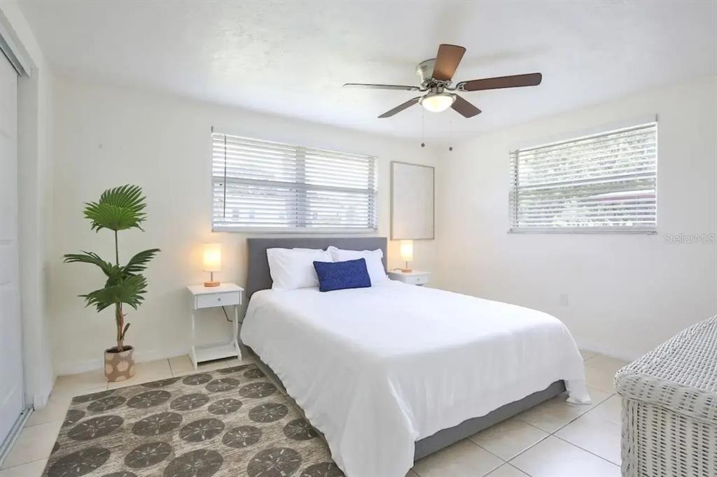 5622 South Lockwood Ridge Road Sarasota, FL 34231 - Photo 15 of 26 a bedroom with bed and a window
