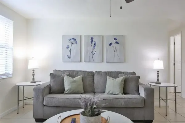 a living room with furniture and a large window