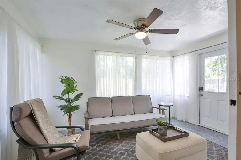 5622 South Lockwood Ridge Road Sarasota, FL 34231 - Photo 17 of 26 a living room with furniture and a potted plant