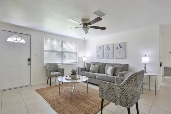 a living room with furniture and a window
