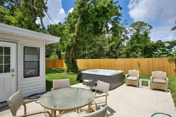 a view of a patio in the backyard