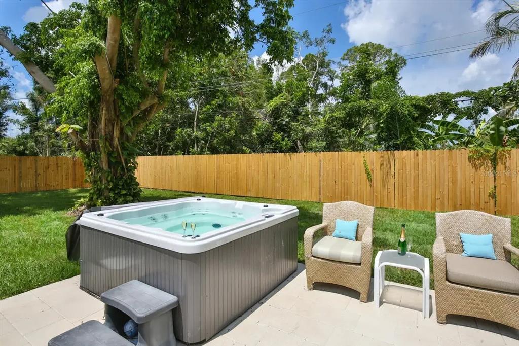 5622 South Lockwood Ridge Road Sarasota, FL 34231 - Photo 3 of 26 a view of an outdoor sitting area in a backyard