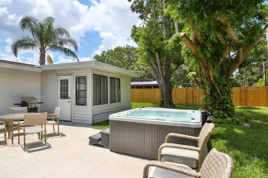 5622 South Lockwood Ridge Road Sarasota, FL 34231 - Photo 4 of 26 a view of a house with a patio