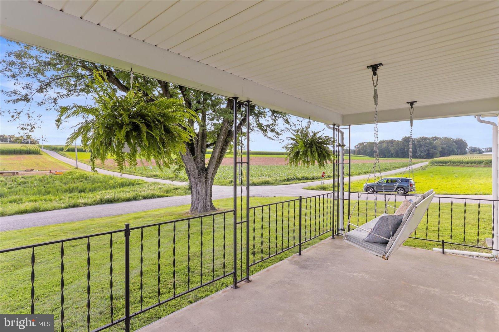 3267 Davis Valley Road Stewartstown, PA 17363 - Photo 8 of 42 Serene porch with scenic countryside views.
