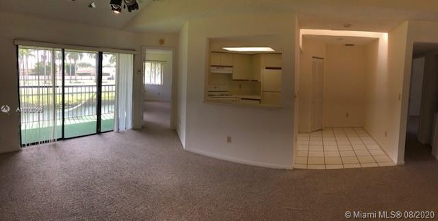 9727 Southwest 138th Avenue, Unit IC2L Miami, FL 33186 - Photo 12 of 44 Kitche and Patio View from Living Room