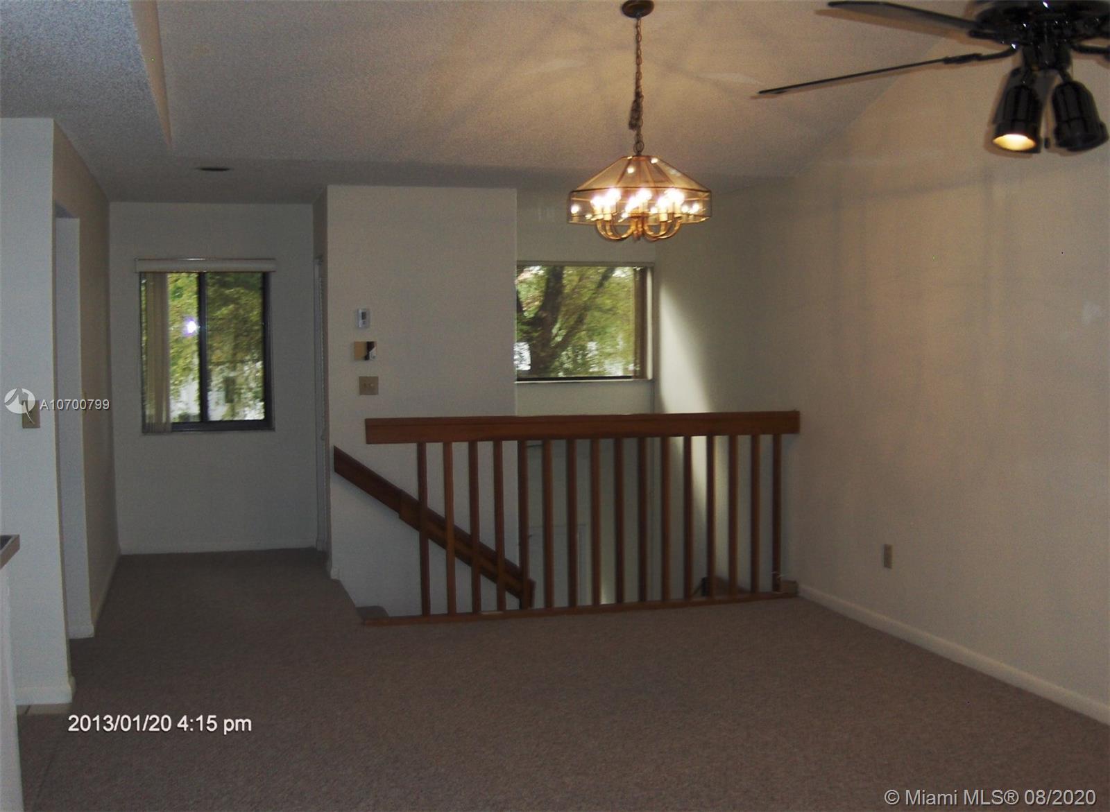 9727 Southwest 138th Avenue, Unit IC2L Miami, FL 33186 - Photo 13 of 44 Entry Stairway, Dining & Living Room