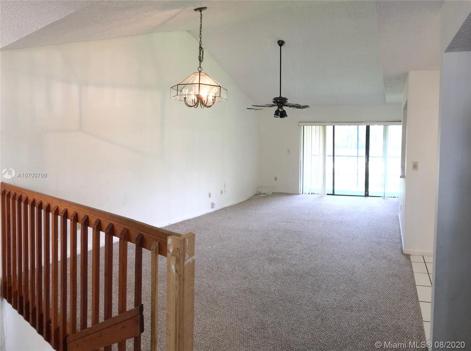 9727 Southwest 138th Avenue, Unit IC2L Miami, FL 33186 - Photo 15 of 44 Living & Dining Area