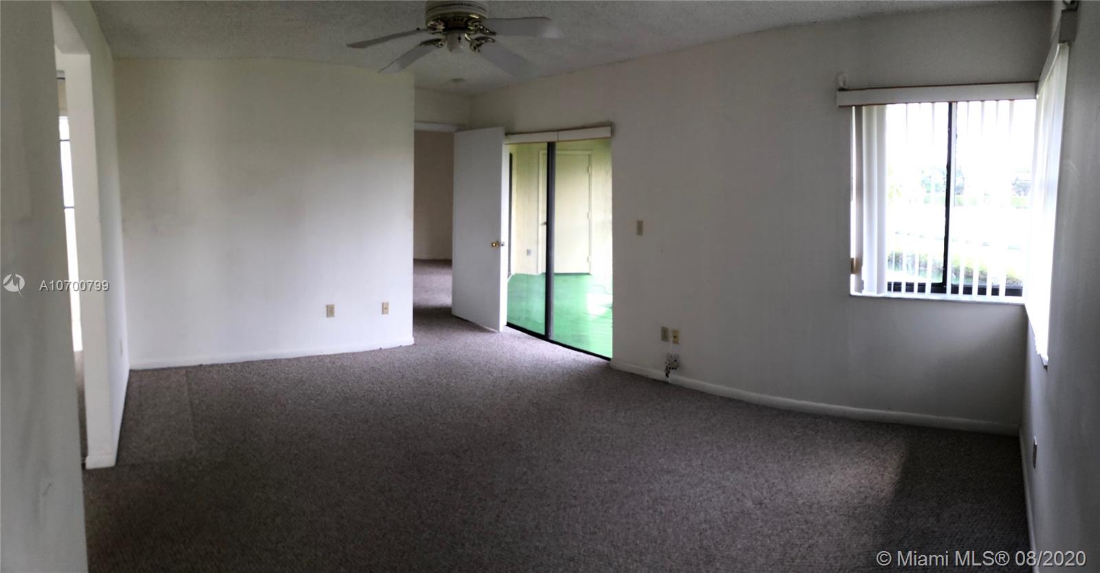 9727 Southwest 138th Avenue, Unit IC2L Miami, FL 33186 - Photo 21 of 44 Master Bedroom and Patio Door to Balcony