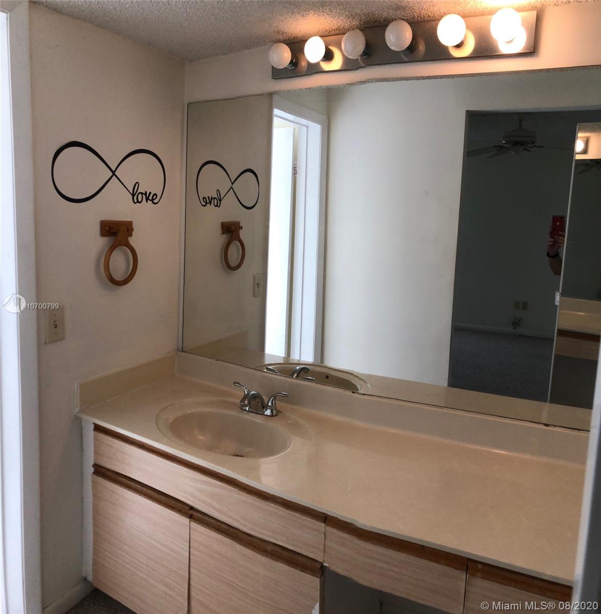 9727 Southwest 138th Avenue, Unit IC2L Miami, FL 33186 - Photo 22 of 44 Master Bath Vanity