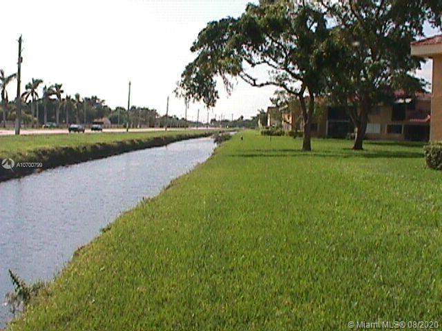 9727 Southwest 138th Avenue, Unit IC2L Miami, FL 33186 - Photo 37 of 44 Wide Canal and Greenway