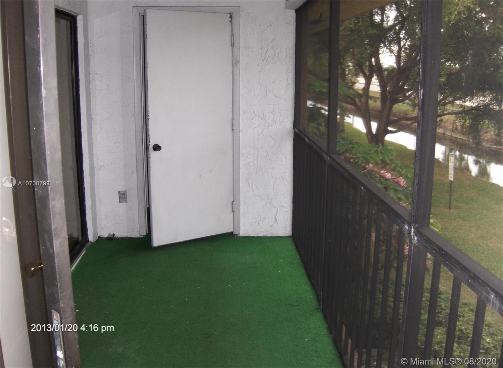 9727 Southwest 138th Avenue, Unit IC2L Miami, FL 33186 - Photo 38 of 44 Screened Patio and Storage Closet