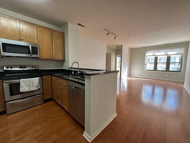 26 Ave At Port Imperial, Unit 210 West New York, NJ 07093 - Photo 1 of 10 a kitchen with stainless steel appliances granite countertop a stove and a sink
