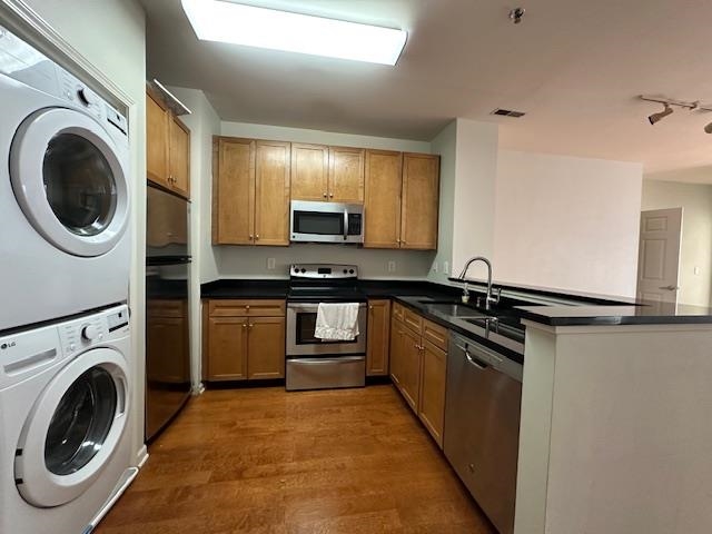 26 Ave At Port Imperial, Unit 210 West New York, NJ 07093 - Photo 2 of 10 a kitchen with a refrigerator and a stove top oven