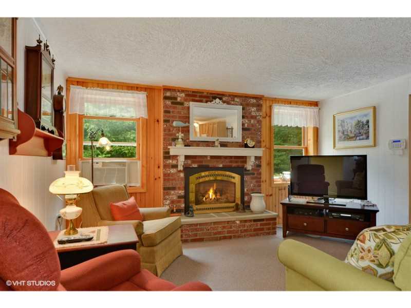 80 Mautucket Road South Kingstown, RI 02879 - Photo 3 of 15 Living Room. .Brick fireplace with gas insert in living area.