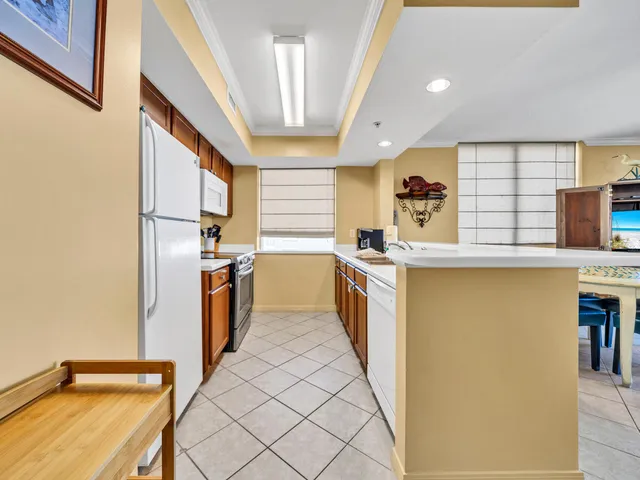 a kitchen with stainless steel appliances a refrigerator and a stove