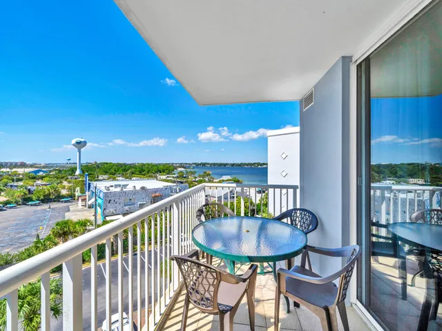 a view of a chairs and table in patio