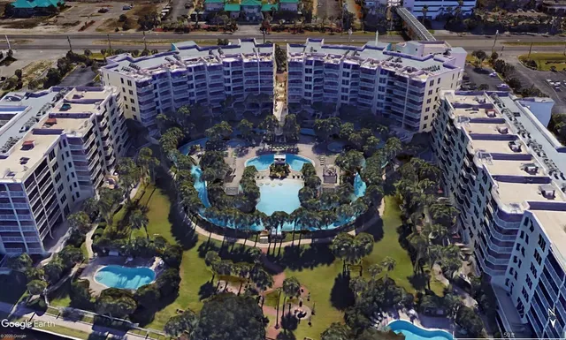 a view of water with a table and chairs