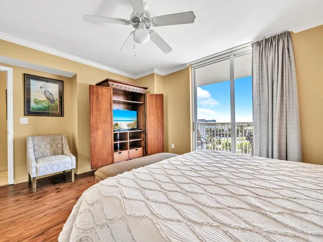 a bedroom with a large bed and a window