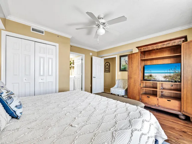 a bedroom with a bed and a dresser