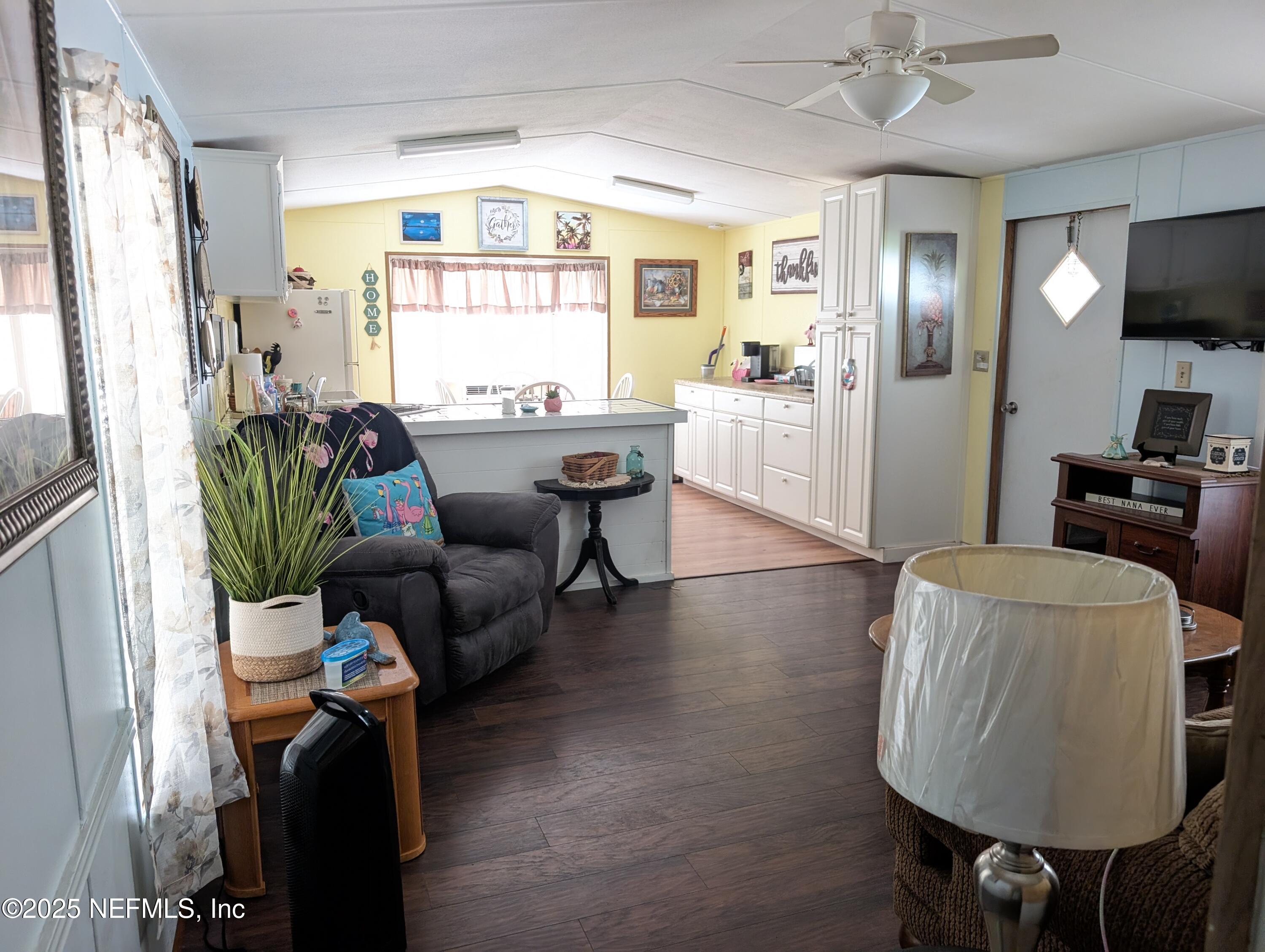 114 Ash Street Interlachen, FL 32148 - Photo 12 of 22 a living room with furniture and a window