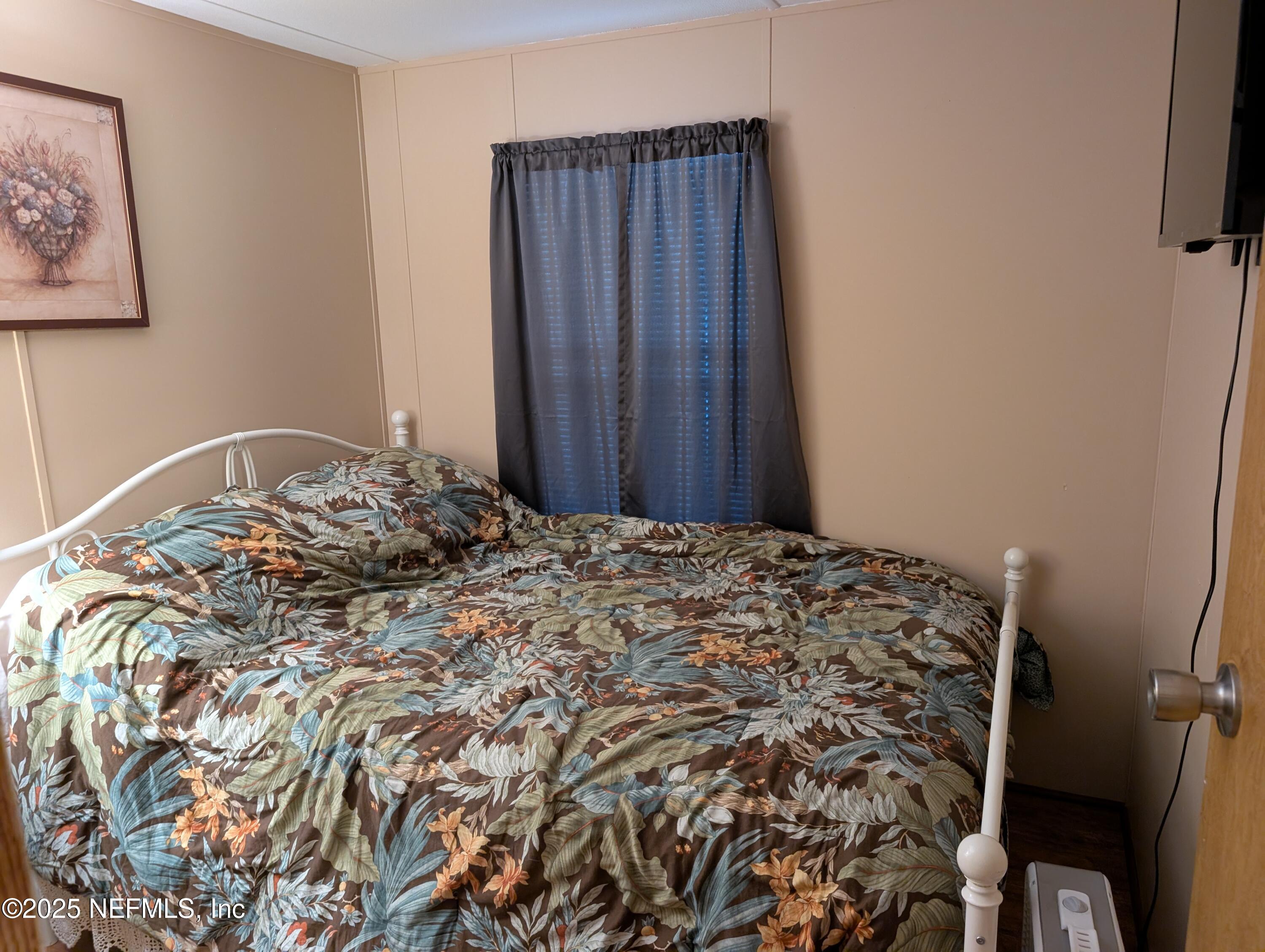 114 Ash Street Interlachen, FL 32148 - Photo 17 of 22 a bedroom with a bed and a window