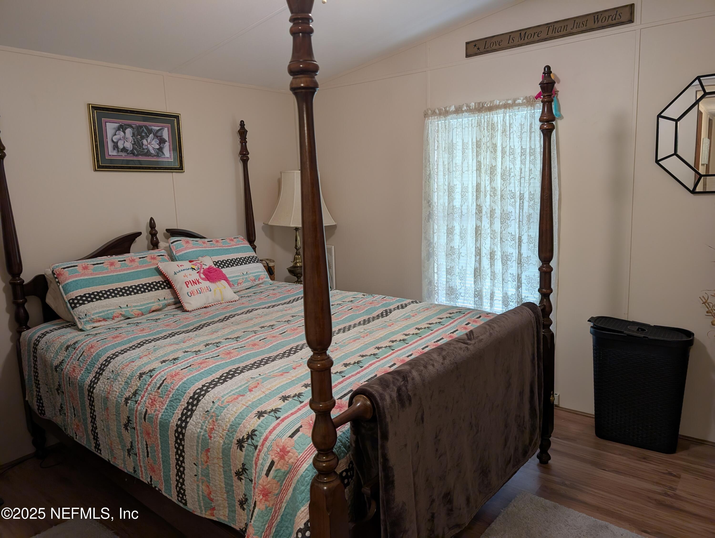 114 Ash Street Interlachen, FL 32148 - Photo 19 of 22 a bedroom with a bed and a window