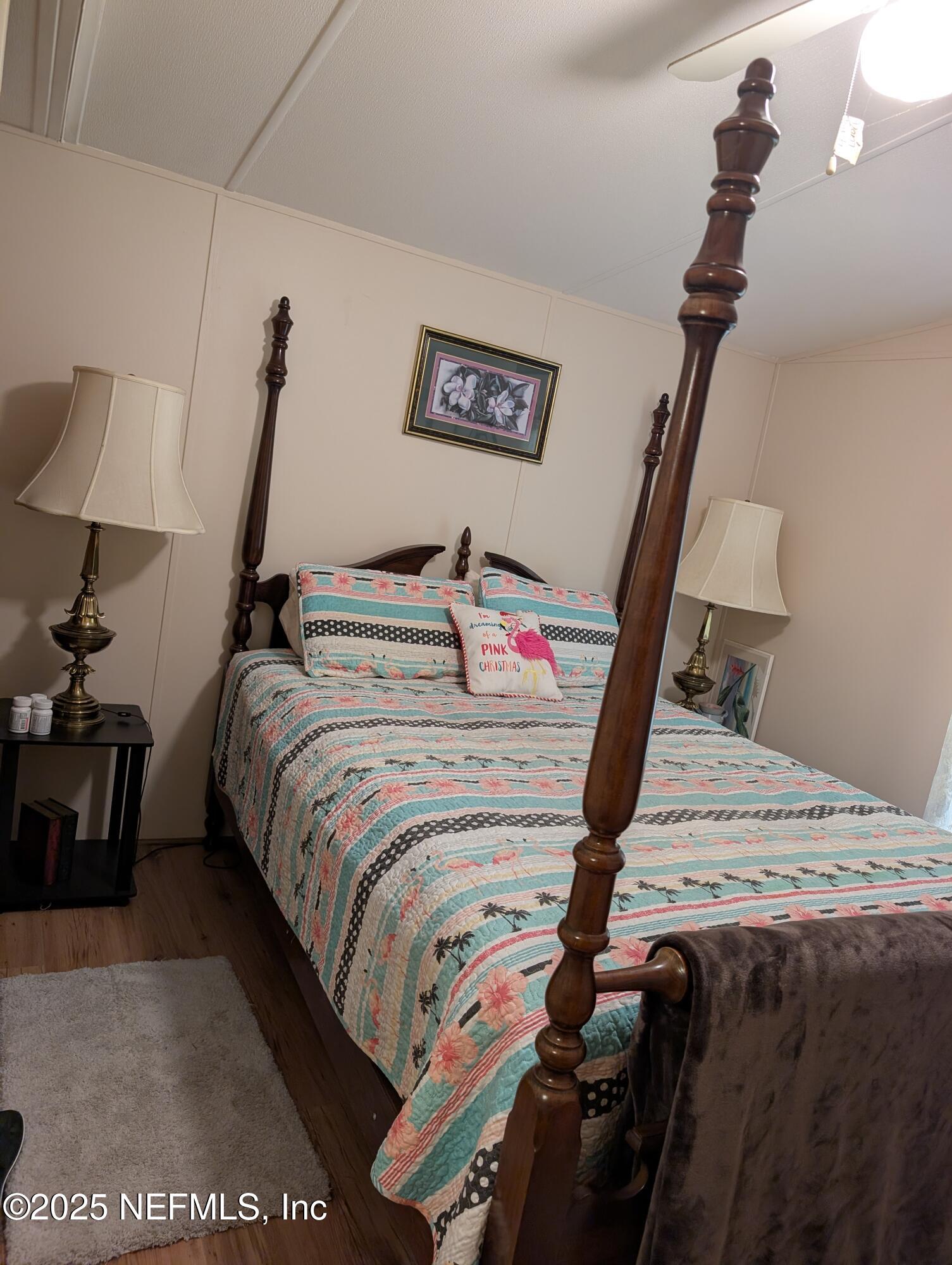 114 Ash Street Interlachen, FL 32148 - Photo 20 of 22 a bedroom with a bed and dresser