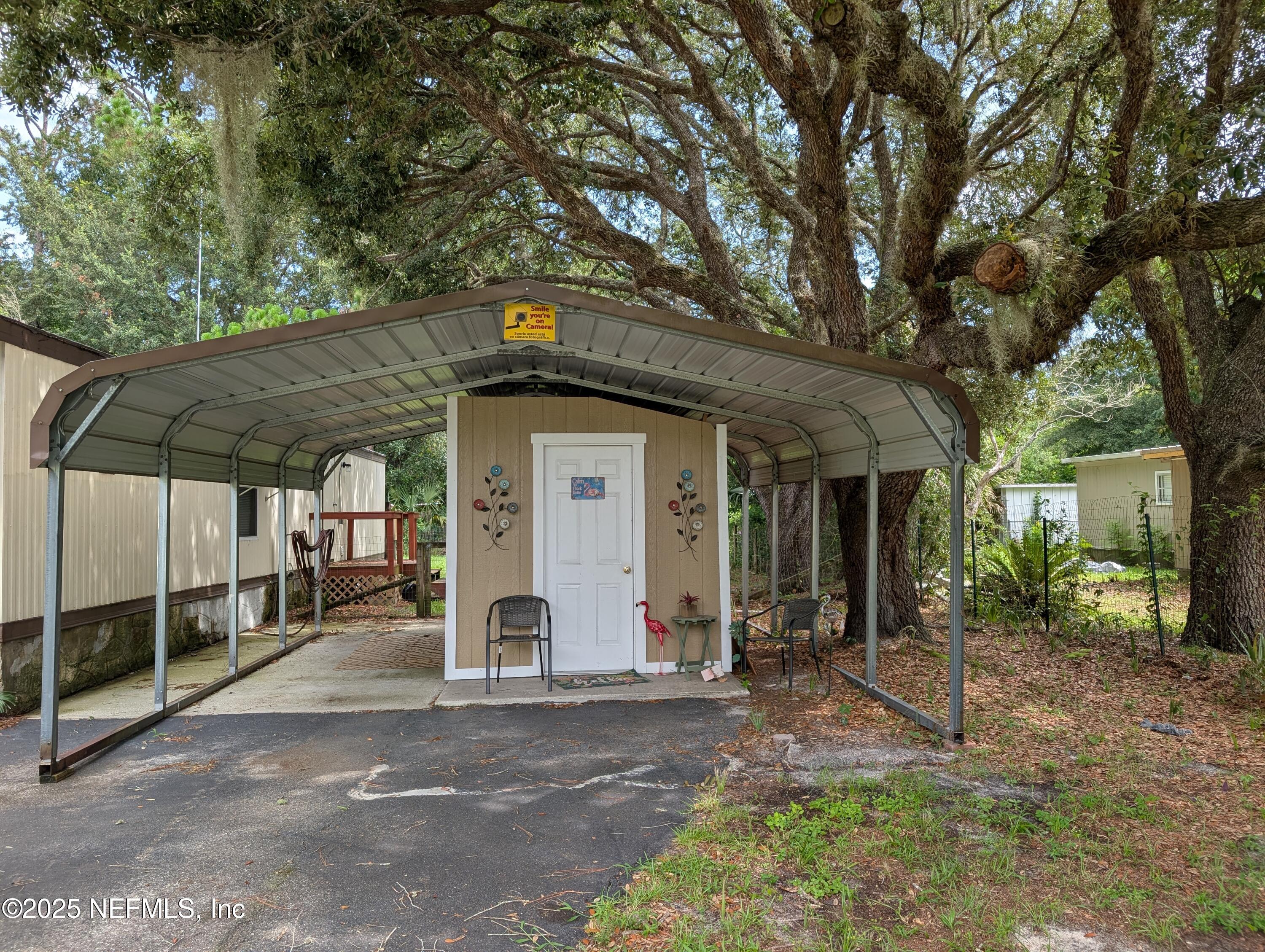114 Ash Street Interlachen, FL 32148 - Photo 5 of 22 a front view of a house with garden