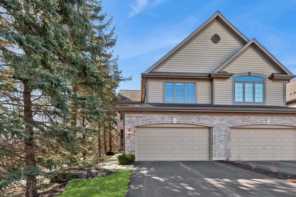 a front view of a house with a garage