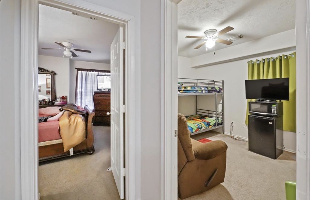 13134 Peppergate Lane Houston, TX 77044 - Photo 19 of 23 a view of a bedroom with workspace and window