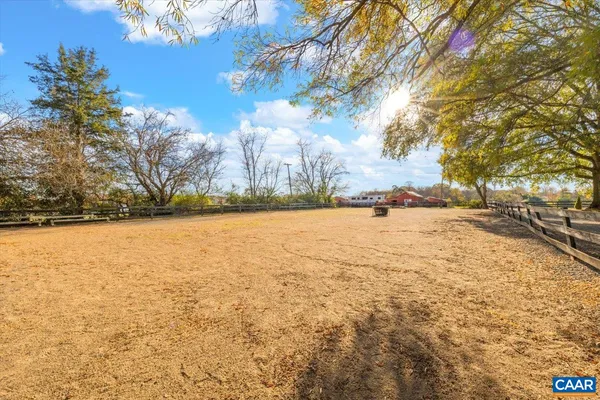 a dining room with furniture a window and a chandelier