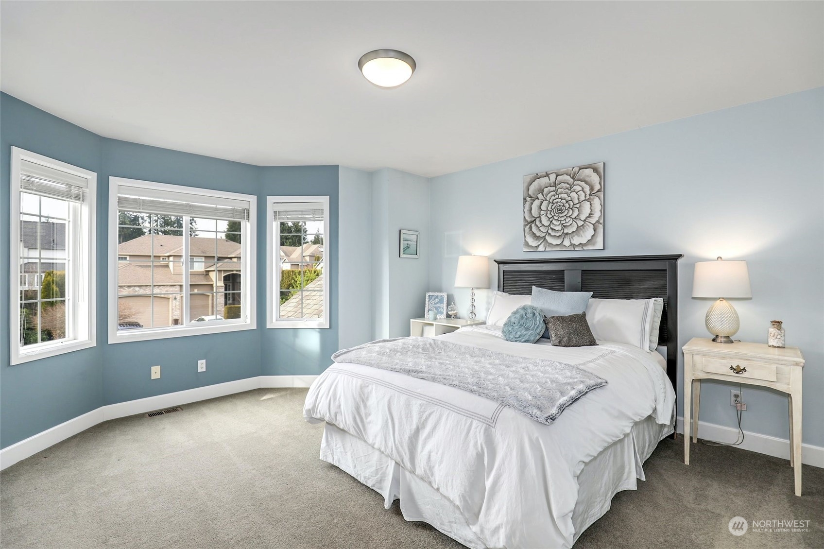 20813 37th Avenue Southeast Bothell, WA 98021 - Photo 26 of 36 a spacious bedroom with a bed and a large window
