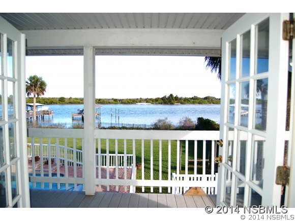 1719 South Riverside Drive Edgewater, FL 32132 - Photo 12 of 24 a view of a porch with a floor to ceiling window