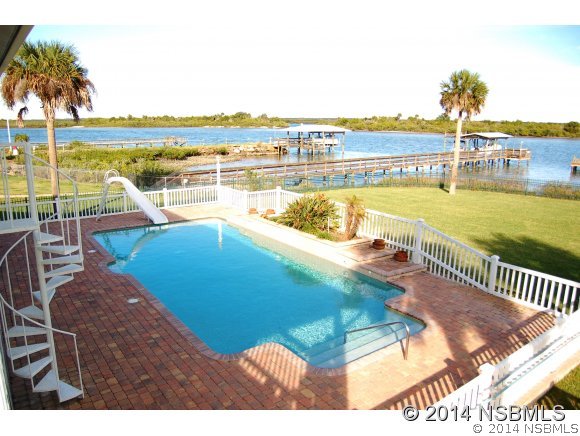 1719 South Riverside Drive Edgewater, FL 32132 - Photo 15 of 24 a view of a swimming pool with an ocean view