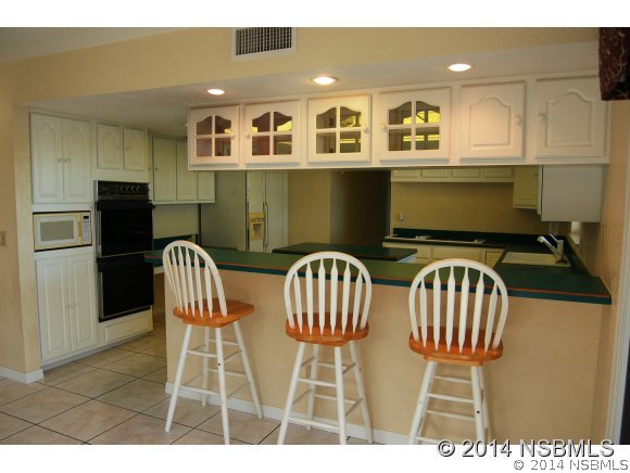 1719 South Riverside Drive Edgewater, FL 32132 - Photo 17 of 24 a view of a dining room with furniture and wooden floor