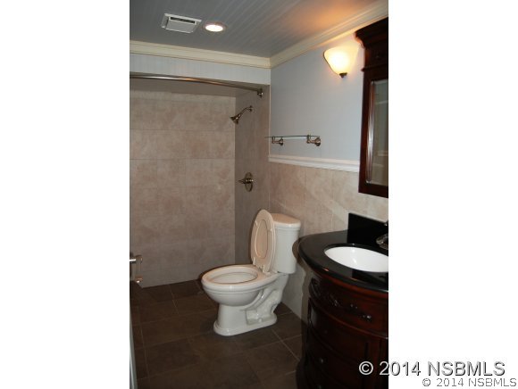 1719 South Riverside Drive Edgewater, FL 32132 - Photo 18 of 24 a bathroom with a sink and a toilet