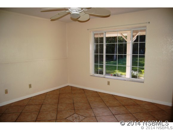 1719 South Riverside Drive Edgewater, FL 32132 - Photo 19 of 24 a view of an empty room with a window