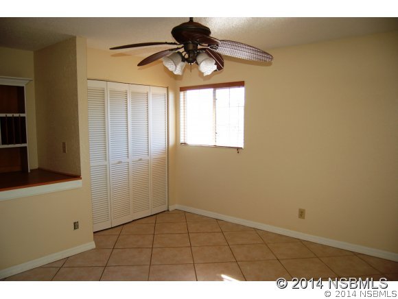 1719 South Riverside Drive Edgewater, FL 32132 - Photo 9 of 24 a view of empty room with wooden floor
