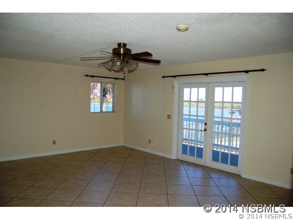 1719 South Riverside Drive Edgewater, FL 32132 - Photo 10 of 24 a view of an empty room with a window