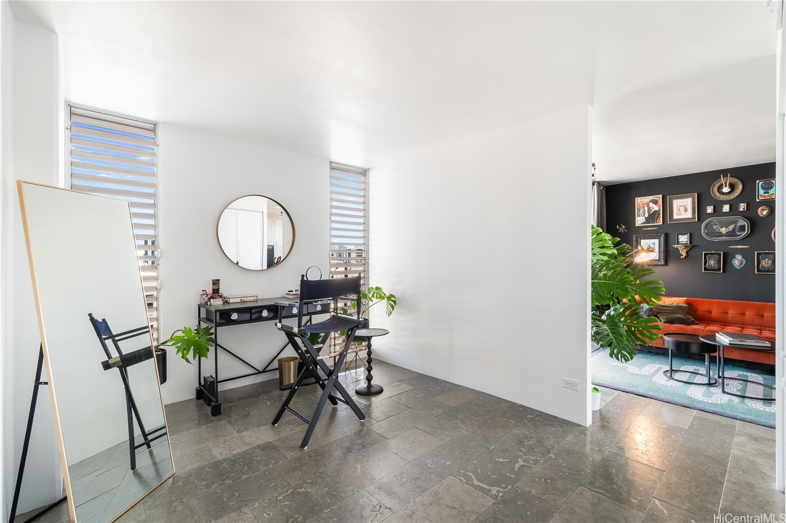 1069 Spencer Street, Unit 402 Honolulu, HI 96822 - Photo 6 of 15 a living room with furniture and a large window