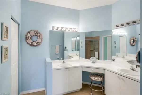 a room with a sink and a mirror