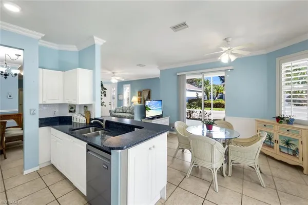 a kitchen that has a sink and cabinets