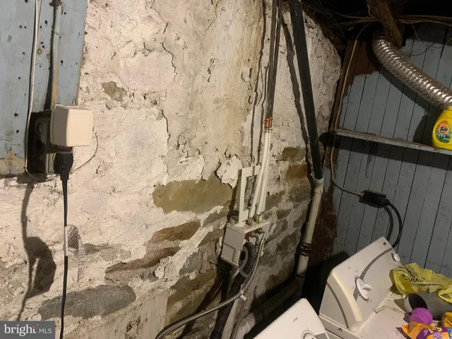 front view of a brick house with large windows