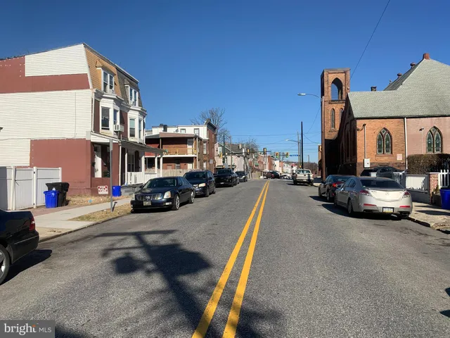a view of a street with cars